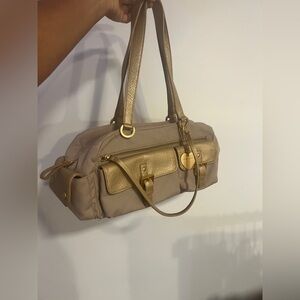 Franco Sarto gold and tan shoulder bag.